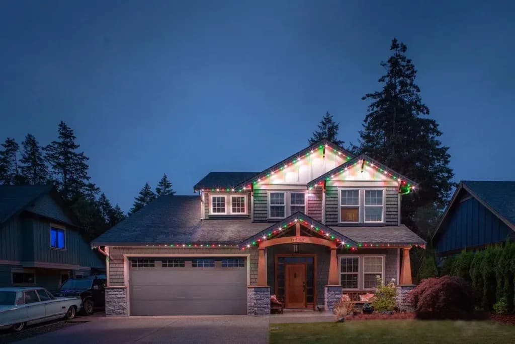 Installer fastening aluminum LED track into a soffit with colour-matched screws
