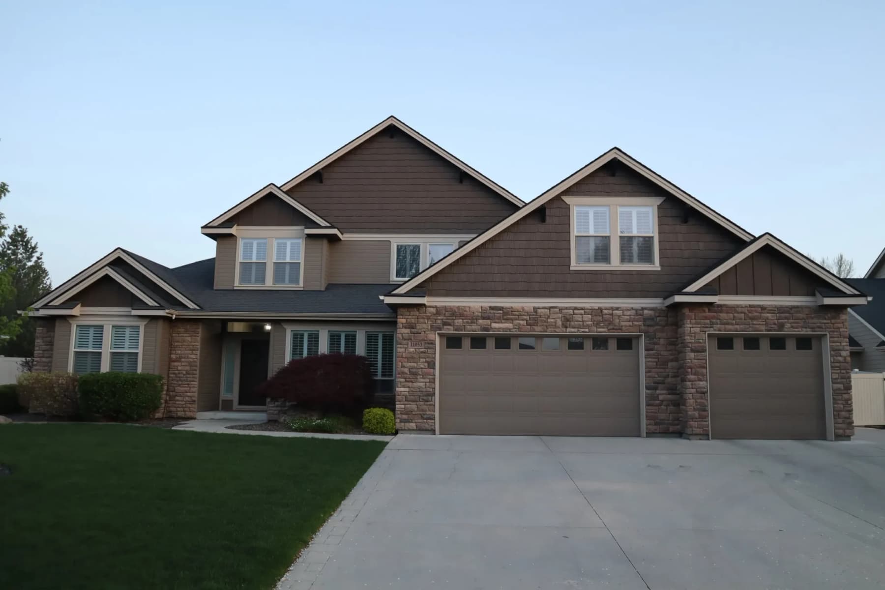 The same home by day, with the aluminum track tucked invisibly into the soffit