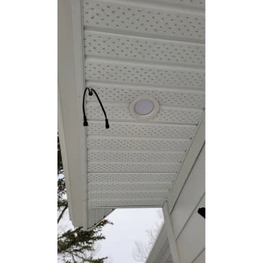 Soffit downlight installed in a white soffit